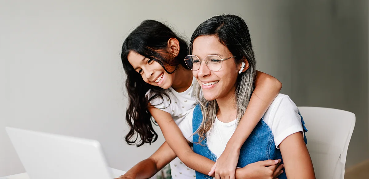 Mother and daughter smiling